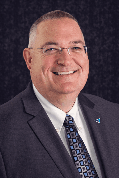 Croghan Bank professional wearing glasses and a tie, smiling in a formal portrait