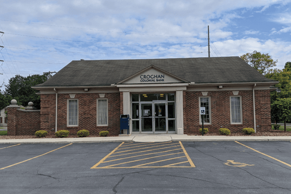 Croghan Colonial Bank branch with classic brick exterior, white columns, and accessible parking lot
