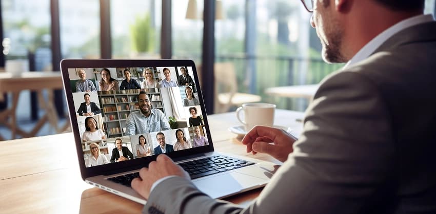 Business professional participating in a virtual video conference on a laptop