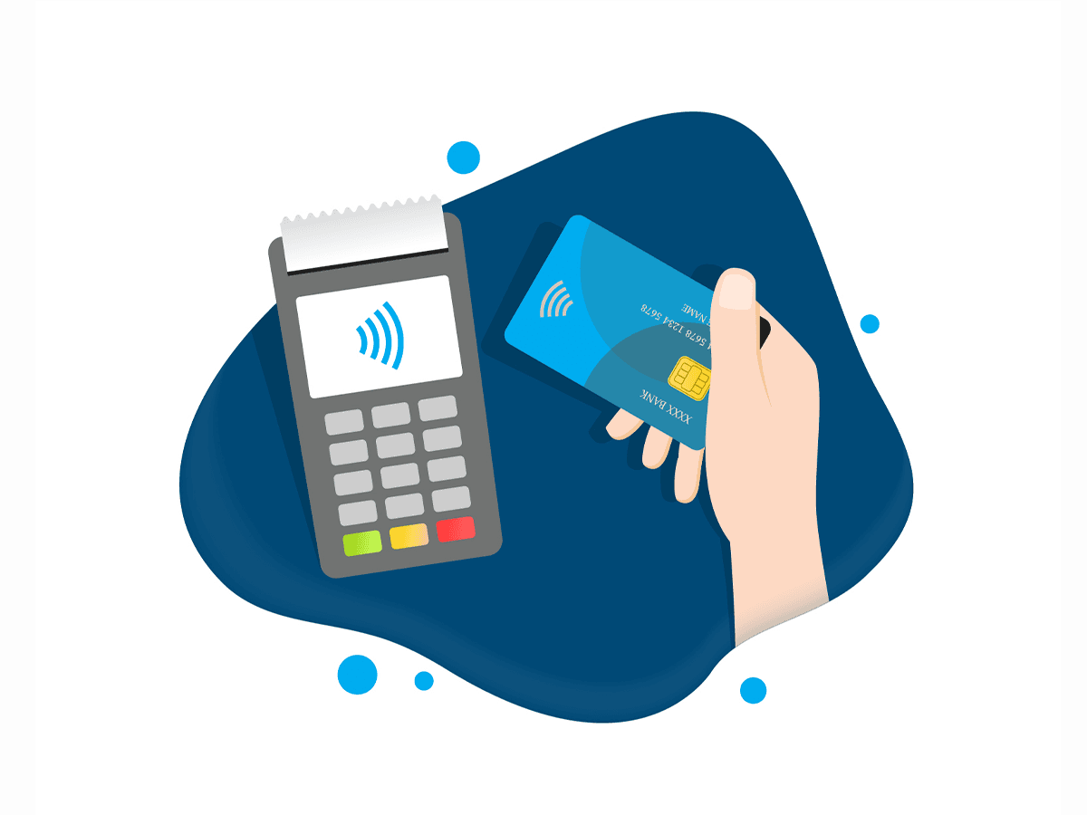A hand holding a credit card near a contactless payment terminal for a tap-to-pay transaction.