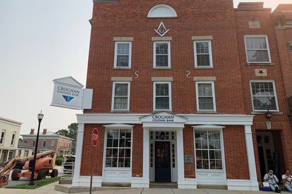 Croghan Colonial Bank brick building with Masonic lodge symbol in a historic downtown district
