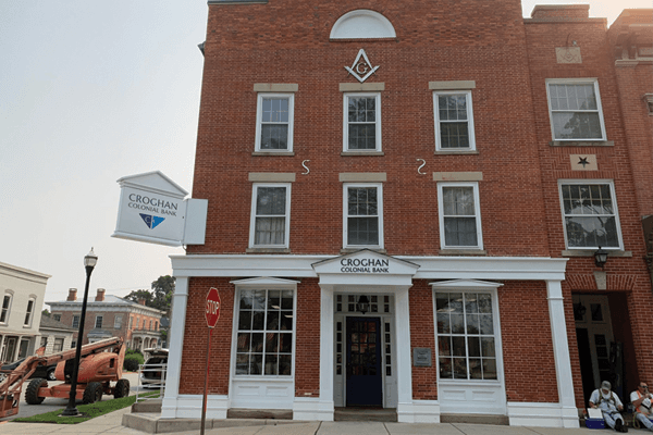 Croghan Colonial Bank brick building with Masonic lodge symbol in a historic downtown district
