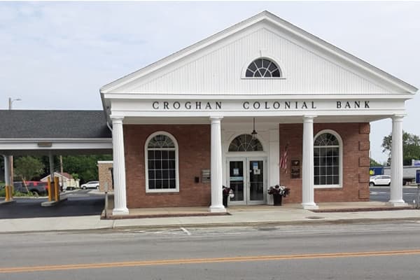 Croghan Colonial Bank branch with white colonial columns, brick facade, and drive-through