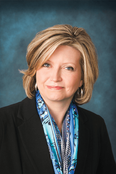Croghan Bank professional in a black blazer with a blue patterned scarf