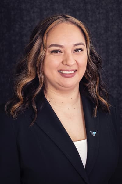Croghan Bank team member smiling in a black blazer with a blue triangle pin