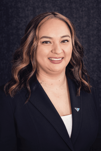 Croghan Bank team member smiling in a black blazer with a blue triangle pin