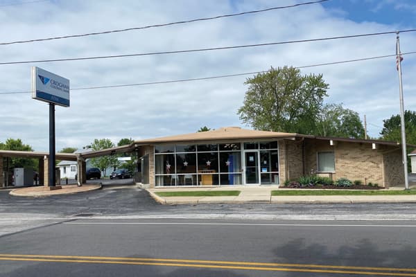 Croghan Colonial Bank branch with drive-through lane, large windows, and roadside signage