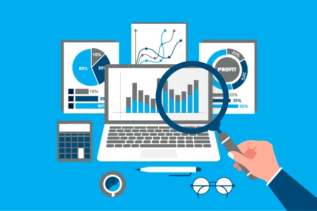 Hand holding magnifying glass over laptop displaying profit charts and financial data