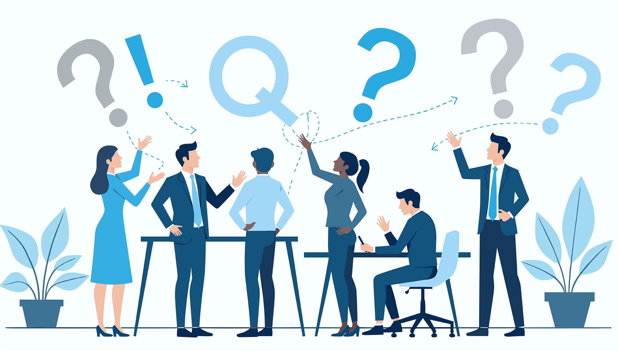 Diverse business team discussing questions and ideas around a conference table