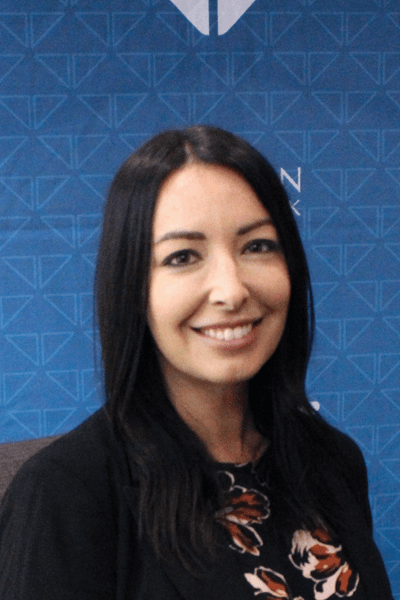 Smiling Croghan Bank team member with dark hair in a professional setting