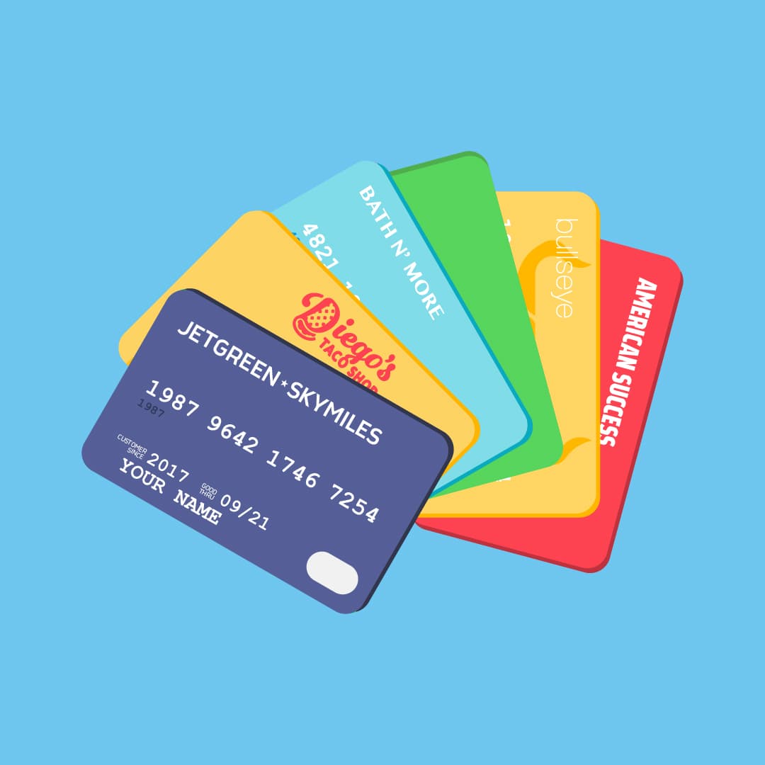A fan of colorful reward and credit cards spread out against a blue background.