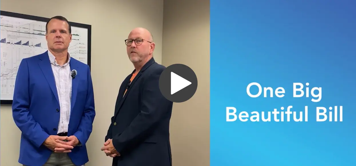 Two financial professionals standing in an office beside a blue slide titled "One Big Beautiful Bill."