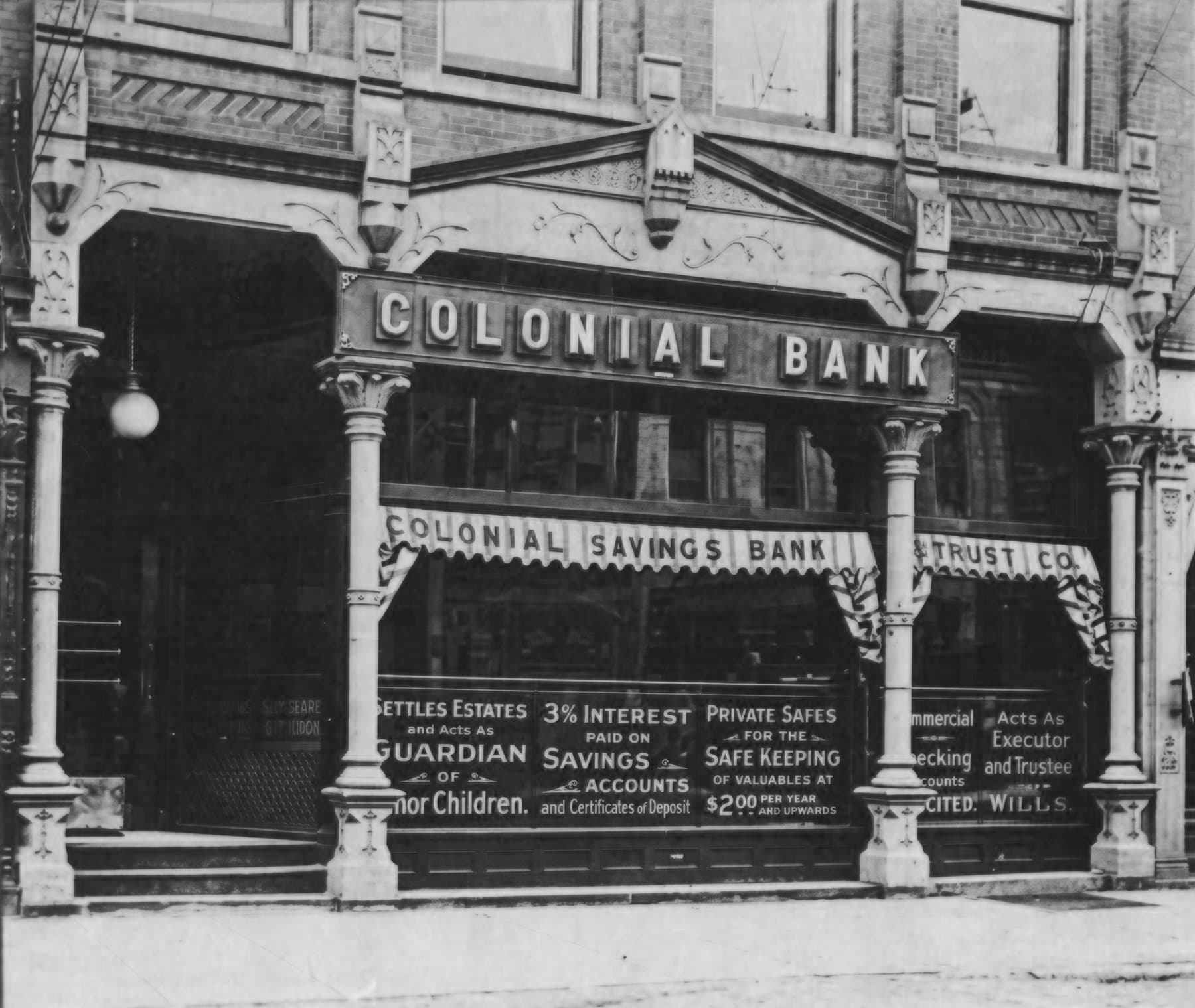 Historic black and white photo of the Colonial Savings Bank storefront